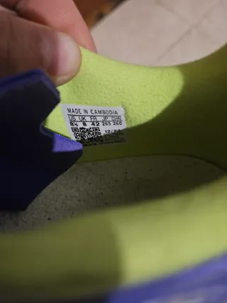 Botas de fútbol Adidas verdes y moradas