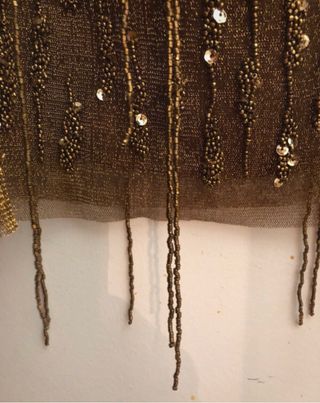 Falda Zara dorada con abalorios