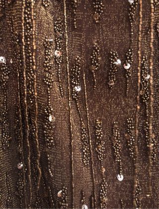 Falda Zara dorada con abalorios