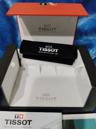 Caja Reloj Tissot + Libro La Novela de una Fábrica