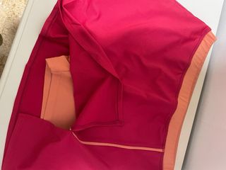 Falda deportiva Artengo roja y naranja