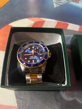 Reloj Rolex Submariner Azul y Dorado de Acero