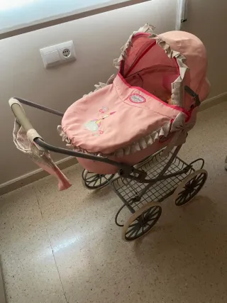 Carrito de muñecas rosa
