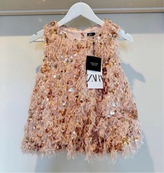 Top lentejuelas plumas