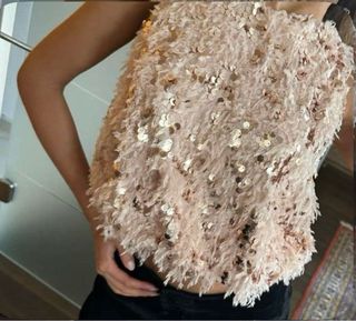 Top lentejuelas plumas