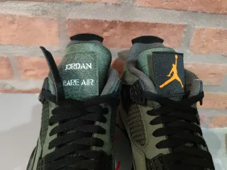Jordan 4 Undefeated Verde Naranja