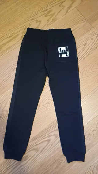 Pantaloni tuta neri con bande laterali - 10-11 y