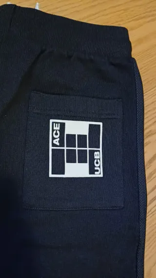 Pantaloni tuta neri con bande laterali - 10-11 y