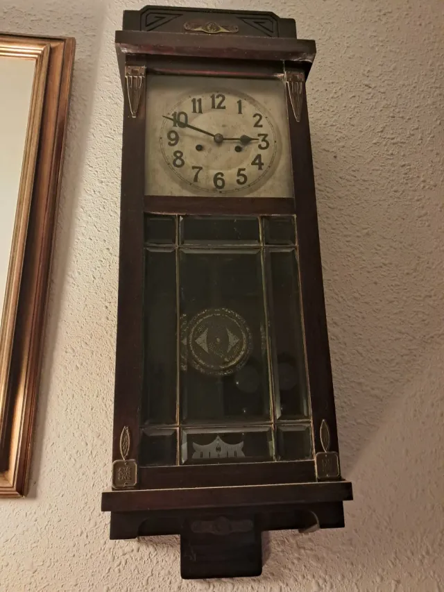 Orologio da parete antico in legno