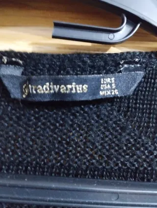 Chaqueta larga negra con flecos