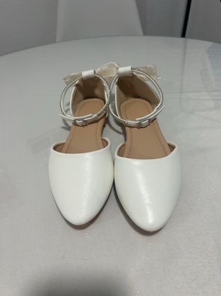 Zapatos comunión blancos con lazo