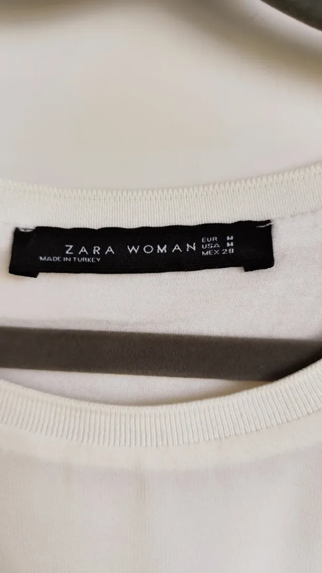 Blusa crema a manica lunga. Con trasparenza