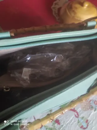 Borsa verde con manici in bambù