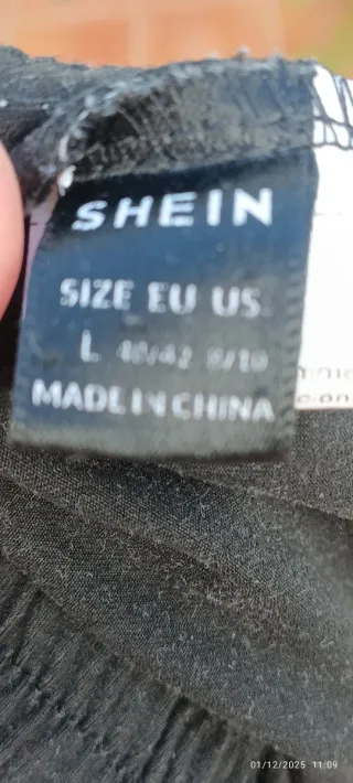 Pantalón corto negro con rayas