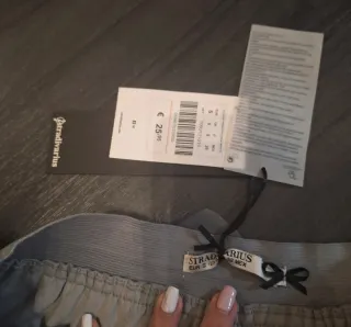 Minifalda Zara plumas gris talla S