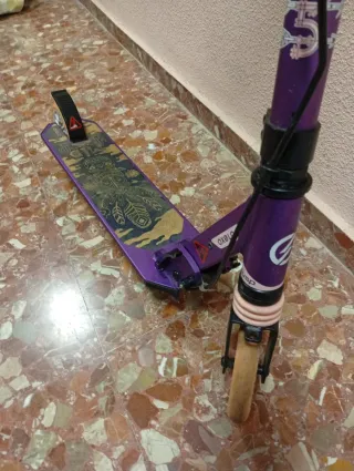 Patinete morado Oxelo