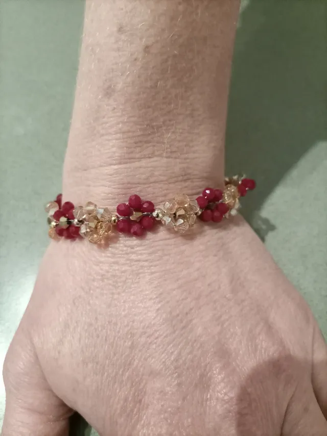 Bracciale semirigido margherite oro e rosso