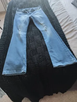 Vaqueros campana desgastados