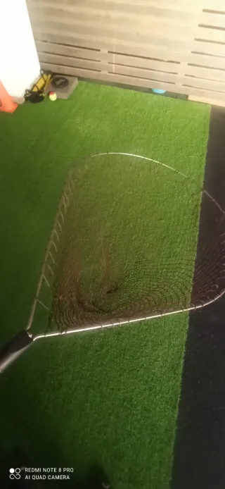 Red de pesca con mango de madera