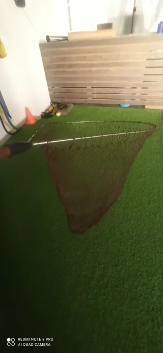 Red de pesca con mango de madera