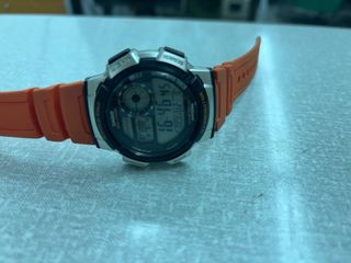 Reloj Casio Naranja y Plateado