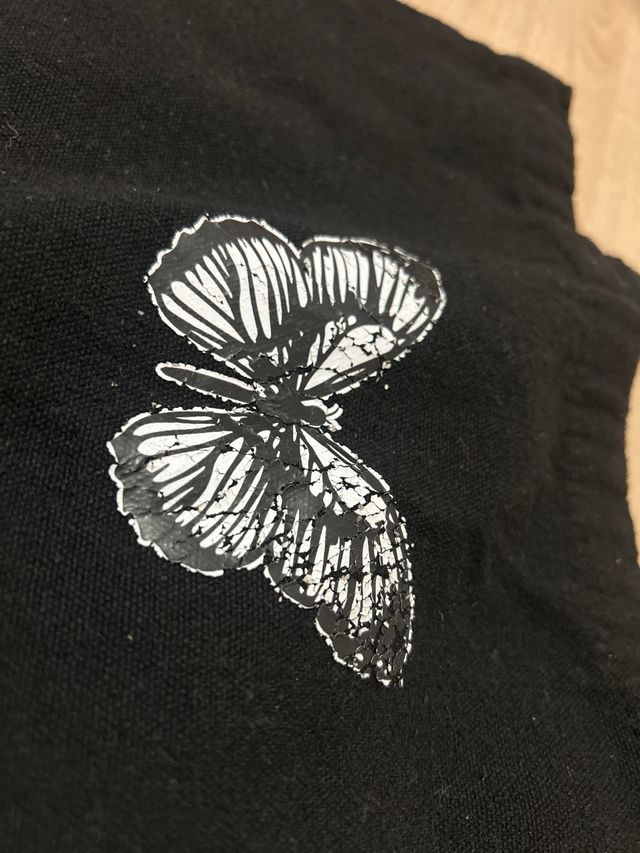 Bolso negro con mariposa