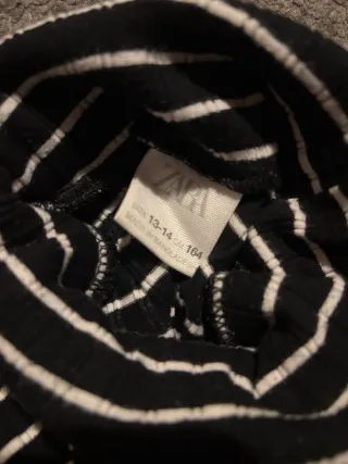 Jersey cuello alto rayas blanco y negro