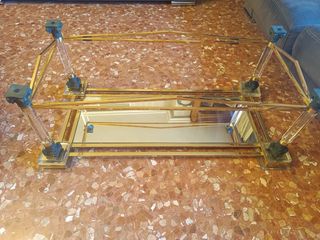 Tavolo da centro in cristallo bisellato e metallo dorato