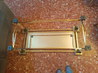 Tavolo da centro in cristallo bisellato e metallo dorato