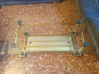 Tavolo da centro in cristallo bisellato e metallo dorato