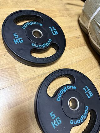 2 discos de caucho 5 kg cada uno