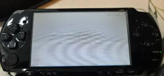 PSP Sony Negra + 4 juegos UMDs