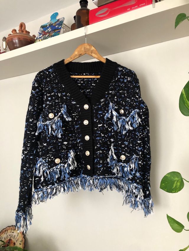 Cárdigan tweed negro con flecos