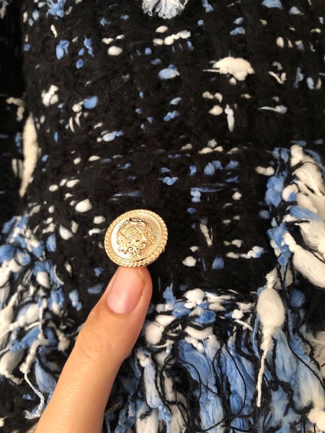 Cárdigan tweed negro con flecos