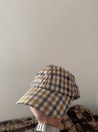 Gorra Aquascutum cuadros azul y marrón