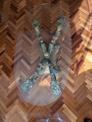 Mesa de centro ovalada cristal y base dorada