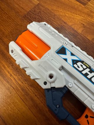 Pistola X-Shot con tambor rotatorio