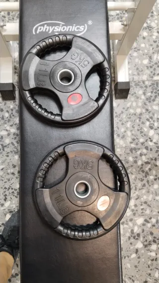 Banco de ejercicios plegable con pesas