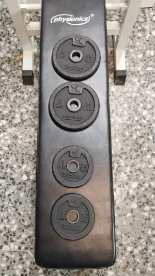 Banco de ejercicios plegable con pesas