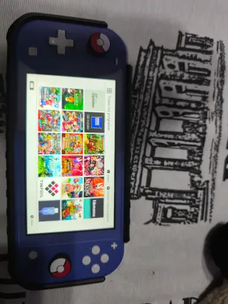 Nintendo Switch Lite Blu + 13 giochi + accessori