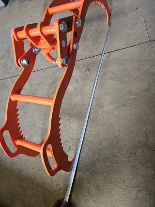 Pluma con pinza pequeña y prolonga manual