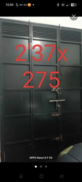 Puerta de cochera de chapa, con chapa de 2'05