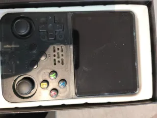 Consola de videojuegos R36S 64 gb mas de 15 mil ju