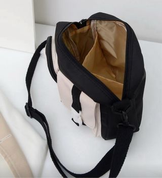 Bolso negro y beige con osito