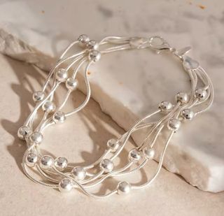 Pulsera triple cadena bolas plata