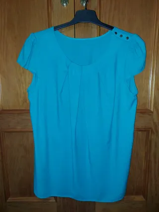 Blusa mujer color turquesa.