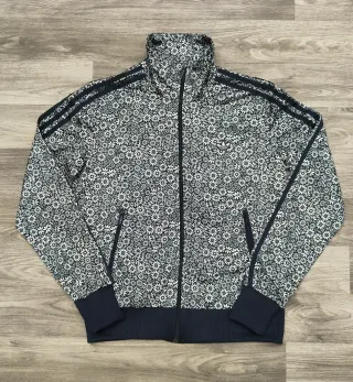 Giacca Adidas floreale nera e bianca