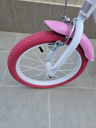 Bicicleta niña rosa con ruedines