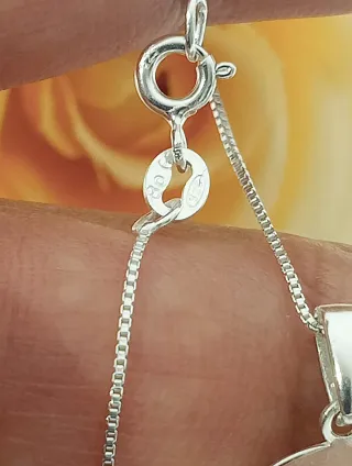 Ojo biselado con cadena en  Plata de Ley