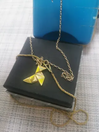 Colgante PAJARITA dorada. Elegir una cadena